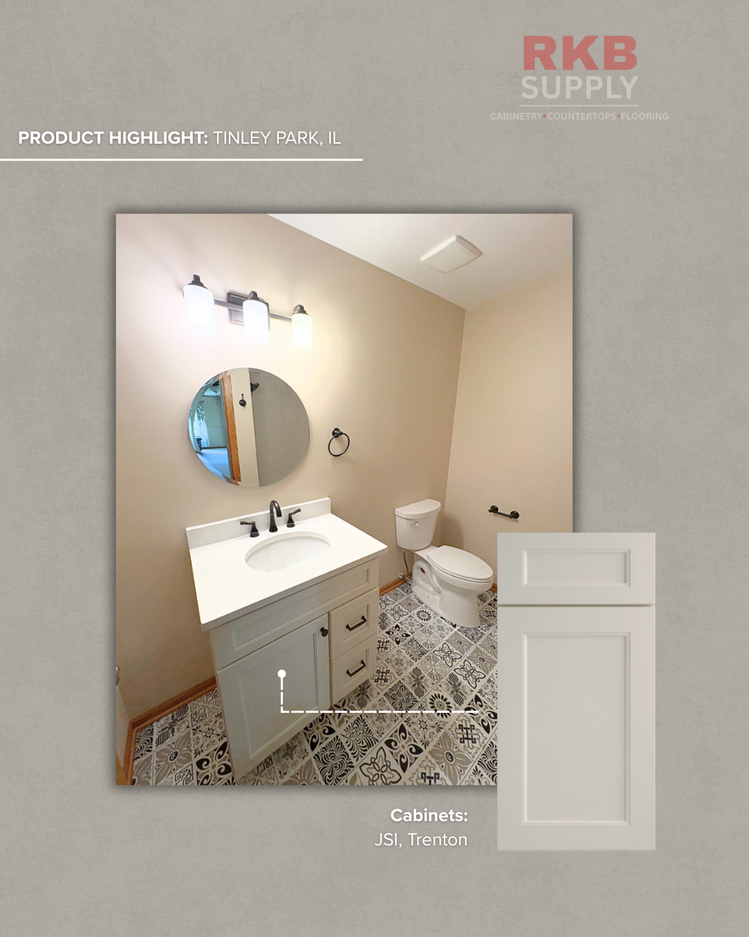 Bathroom remodel featuring a JSI Trenton vanity with a white countertop, round mirror, black fixtures, and patterned tile flooring in a Tinley Park, Illinois home.